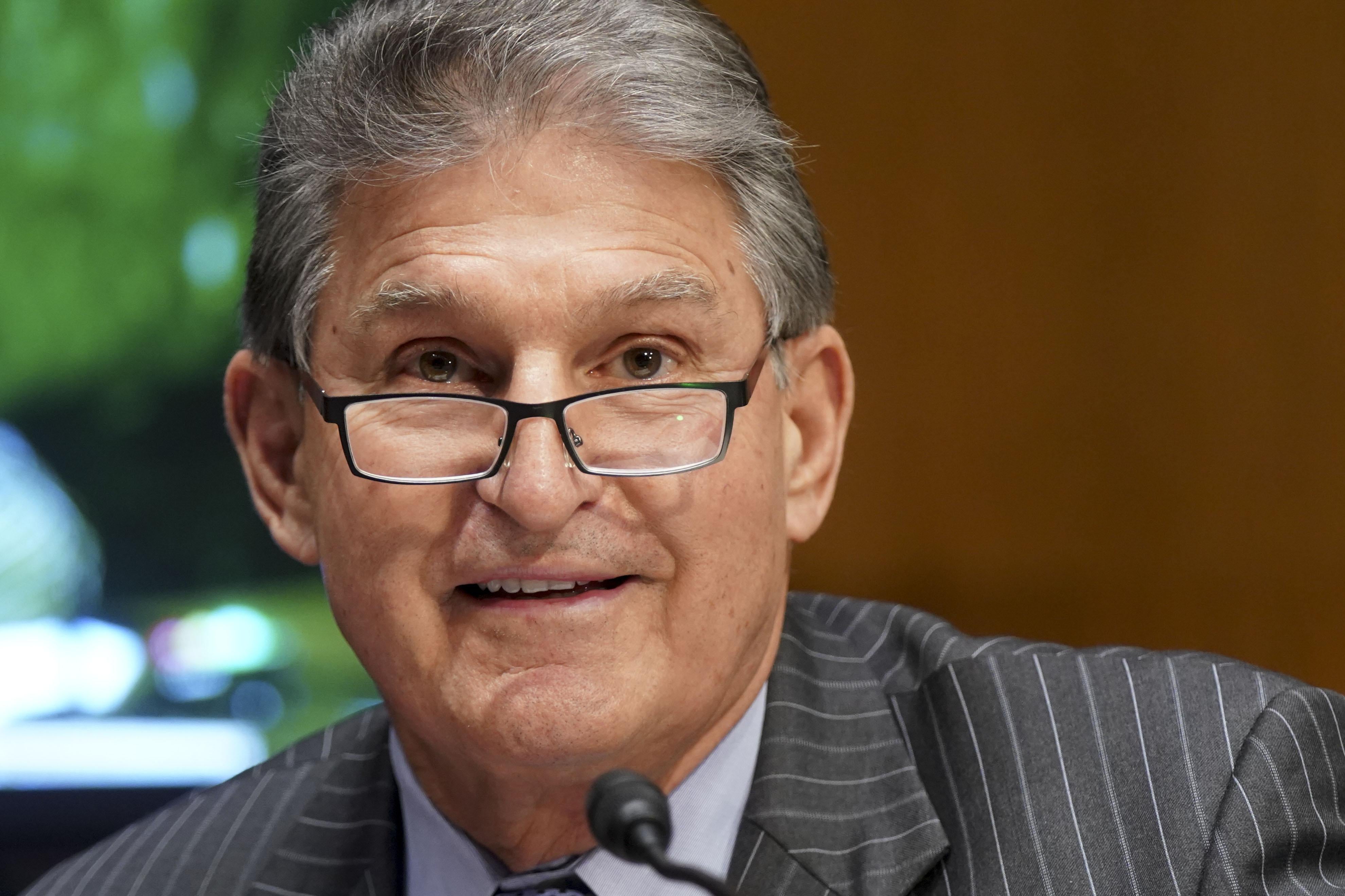 A close up of Manchin during a Senate subcommittee hearing.