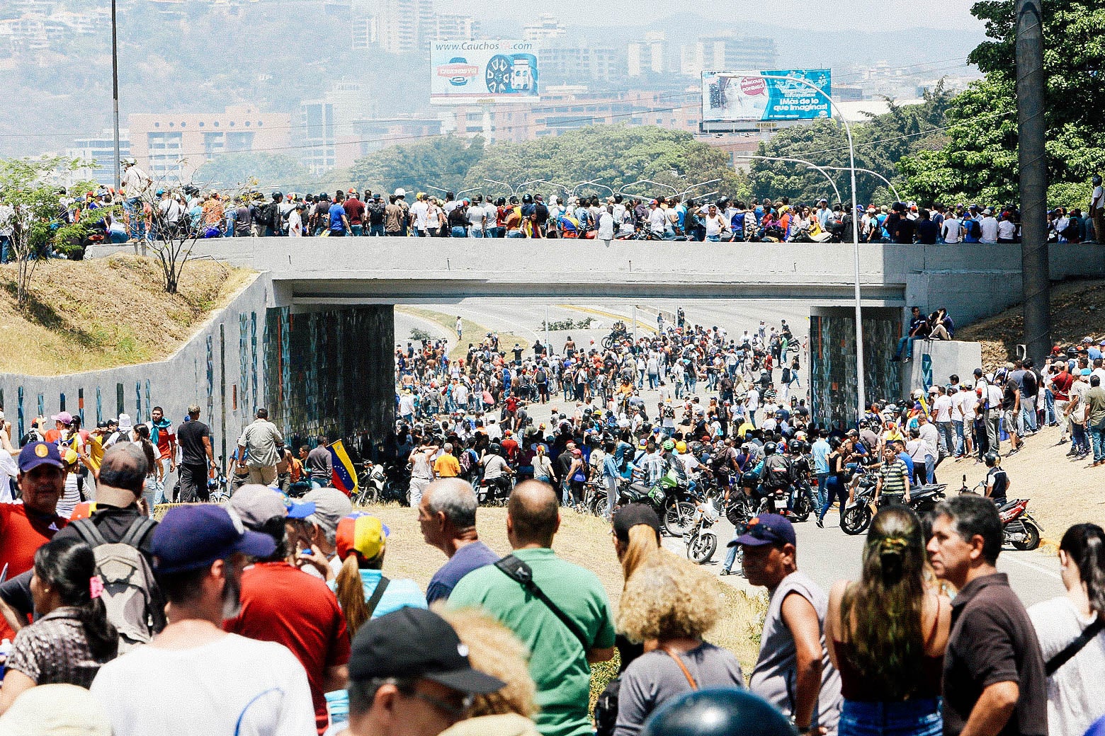 Supporters of Venezuelan opposition leader Juan Guaido gather near La Carlota Air Base.