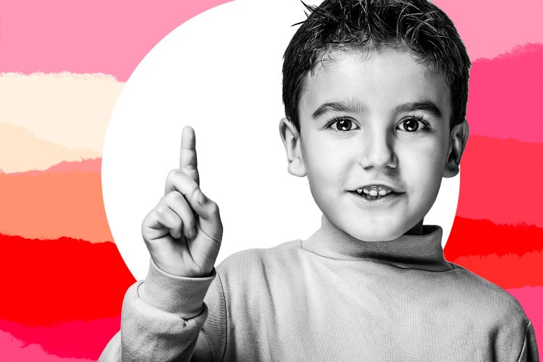 A young boy holds his finger up to make a point.