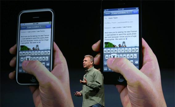 Apple Senior Vice President of Worldwide product marketing Phil Schiller announces the new iPhone 5 during an Apple special event.