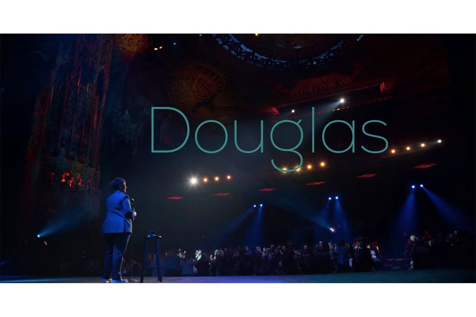 The title screen from Douglas, showing Hannah Gadsby facing the audience at the theater at the Ace Hotel.
