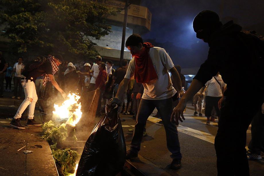 Demonstrators make a barricade of burning garbage during a protest against Venezuela's President Nicolas Maduro's government in Caracas.