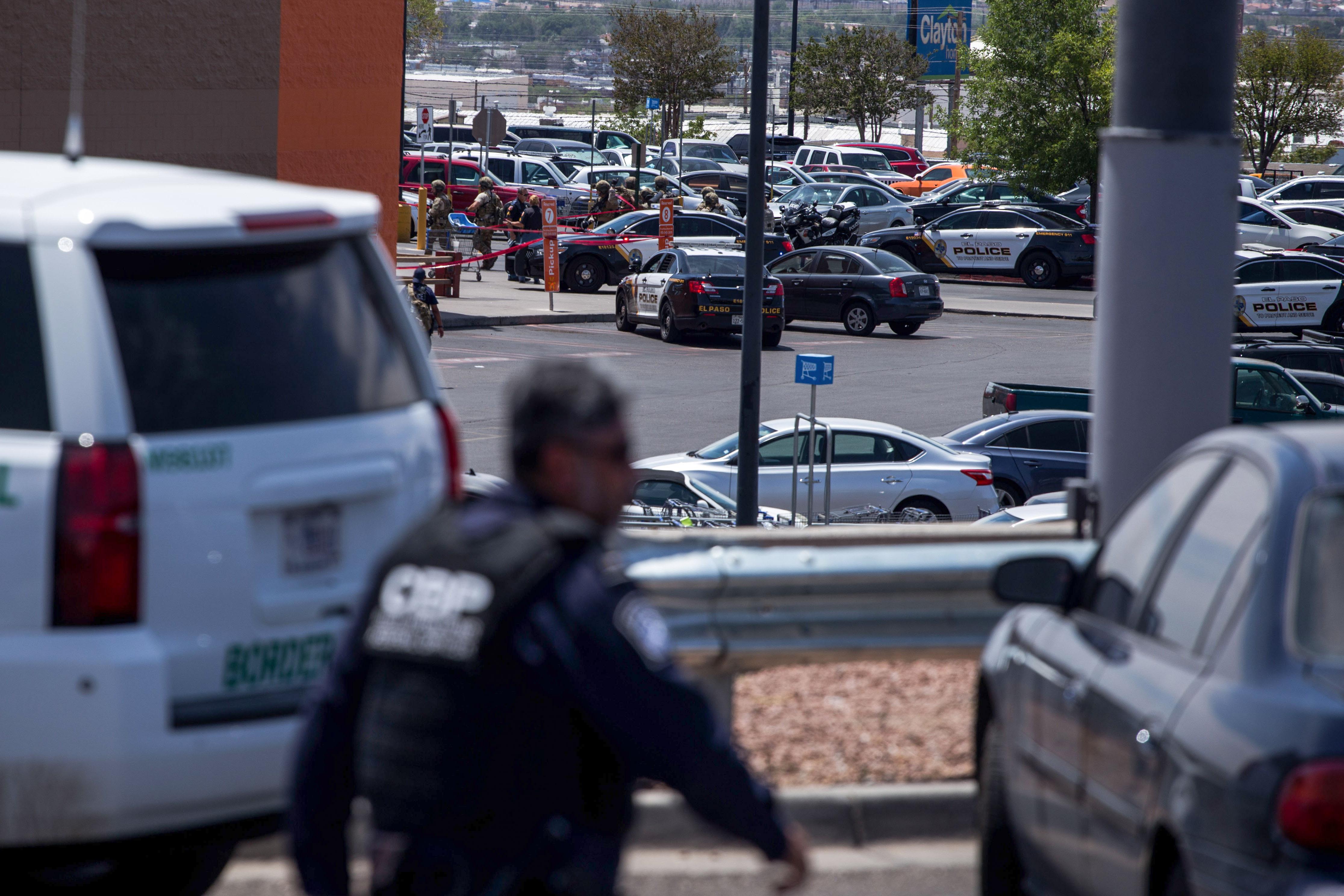 Law enforcement assembled in and around the parking lot.