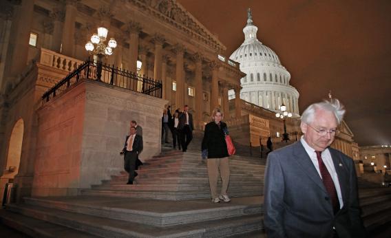 Members of the House of Representatives leave after voting for legislation to avoid the "fiscal cliff" during a rare New Year's Day session Jan. 1, 2013, in Washington, D.C.