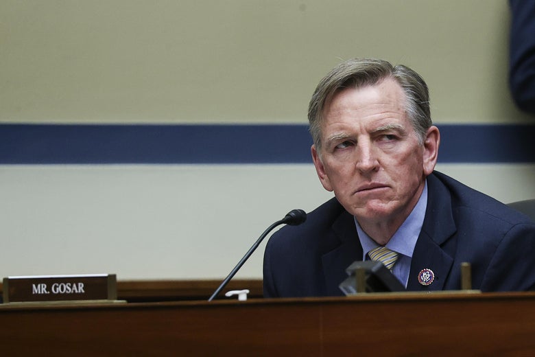 Gosar frowns while sitting in a hearing with a "Mr. Gosar" nameplate in front of him.