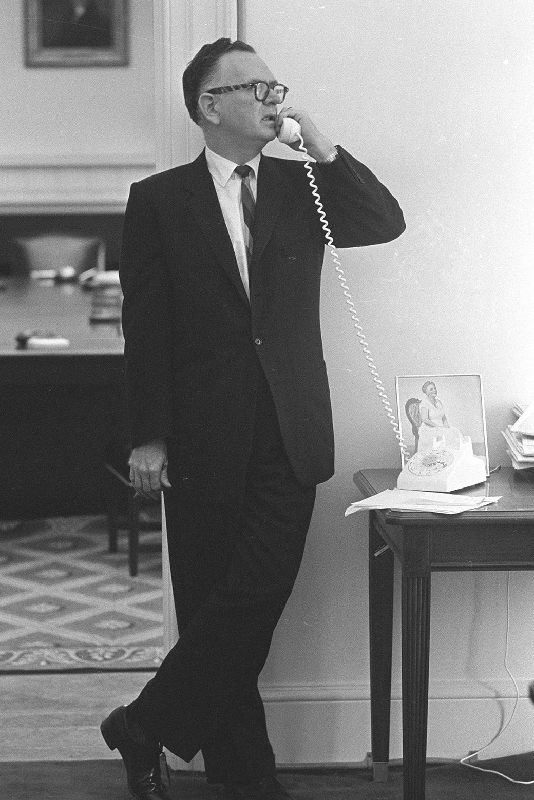 A man speaks on the telephone.