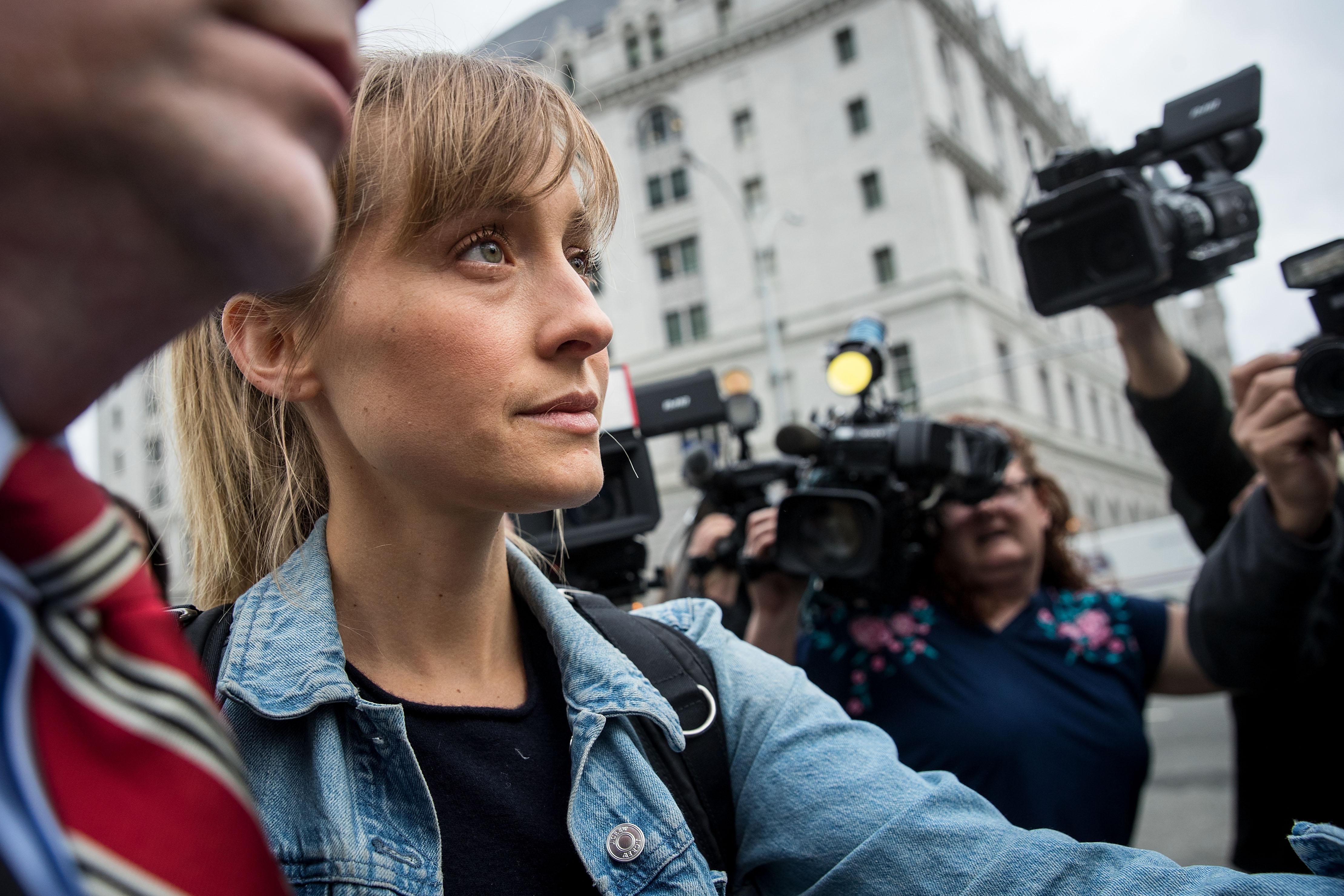 NEW YORK, NY - APRIL 24: Actress Allison Mack leaves U.S. District Court for the Eastern District of New York after a bail hearing, April 24, 2018 in the Brooklyn borough of New York City. Mack was charged last Friday with sex trafficking for her involvement with a self-help organization for women that forced members into sexual acts with their leader. The group, called Nxivm, was led by founder Keith Raniere, who was arrested in March on sex-trafficking charges. She was released on bail at $5 million. (Photo by Drew Angerer/Getty Images)