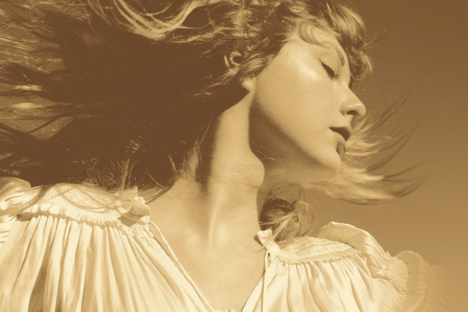 Sepia portrait of Taylor Swift with her face turned and hair blowing out