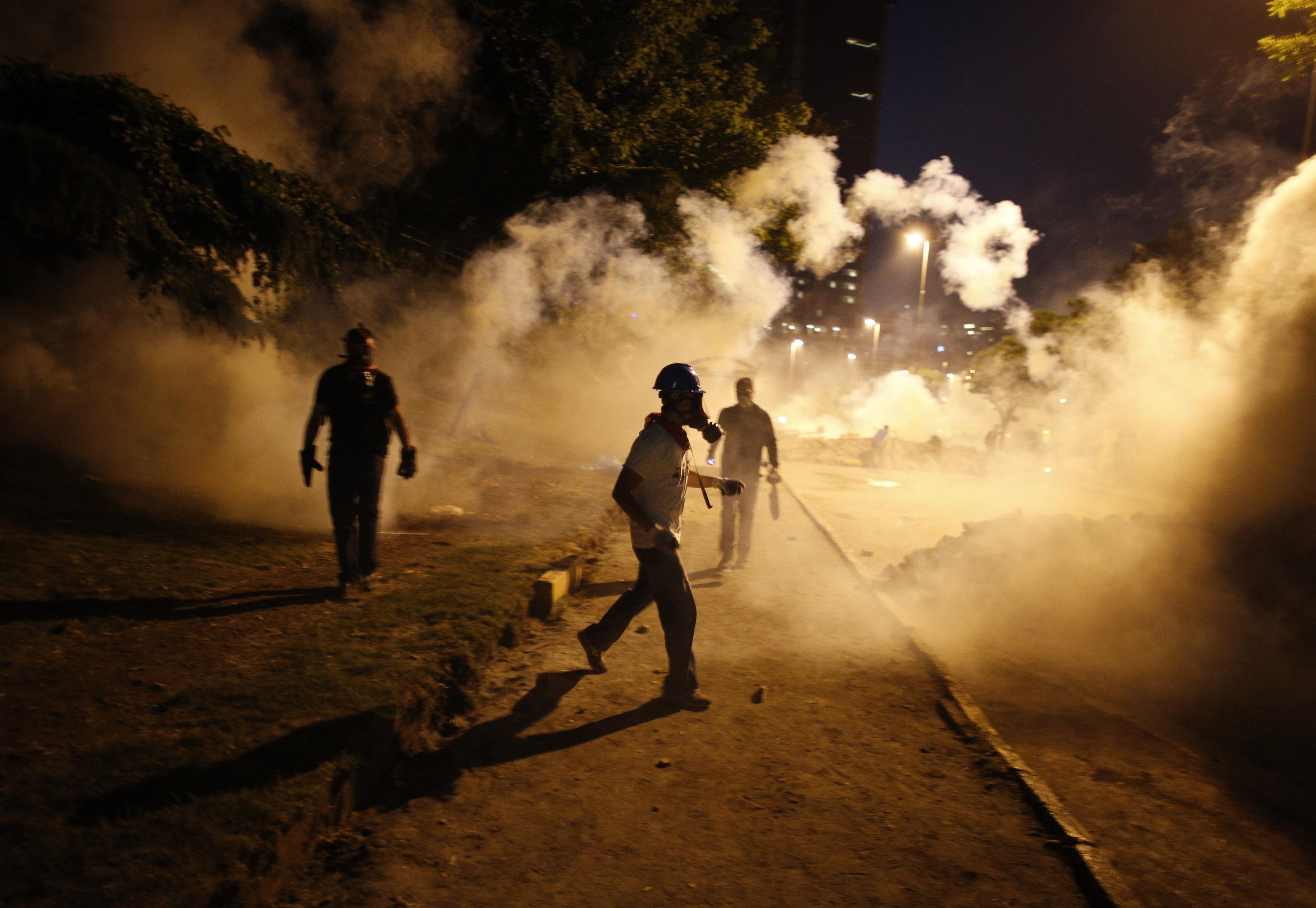 Anti-government protesters clash with riot police in Istanbul June 3.