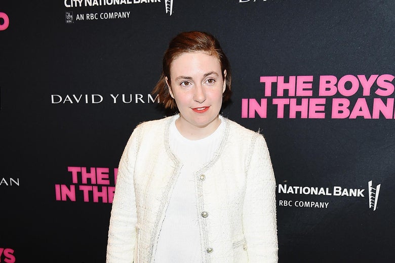 Lena Dunham looks off to the side, wearing a white sweater.