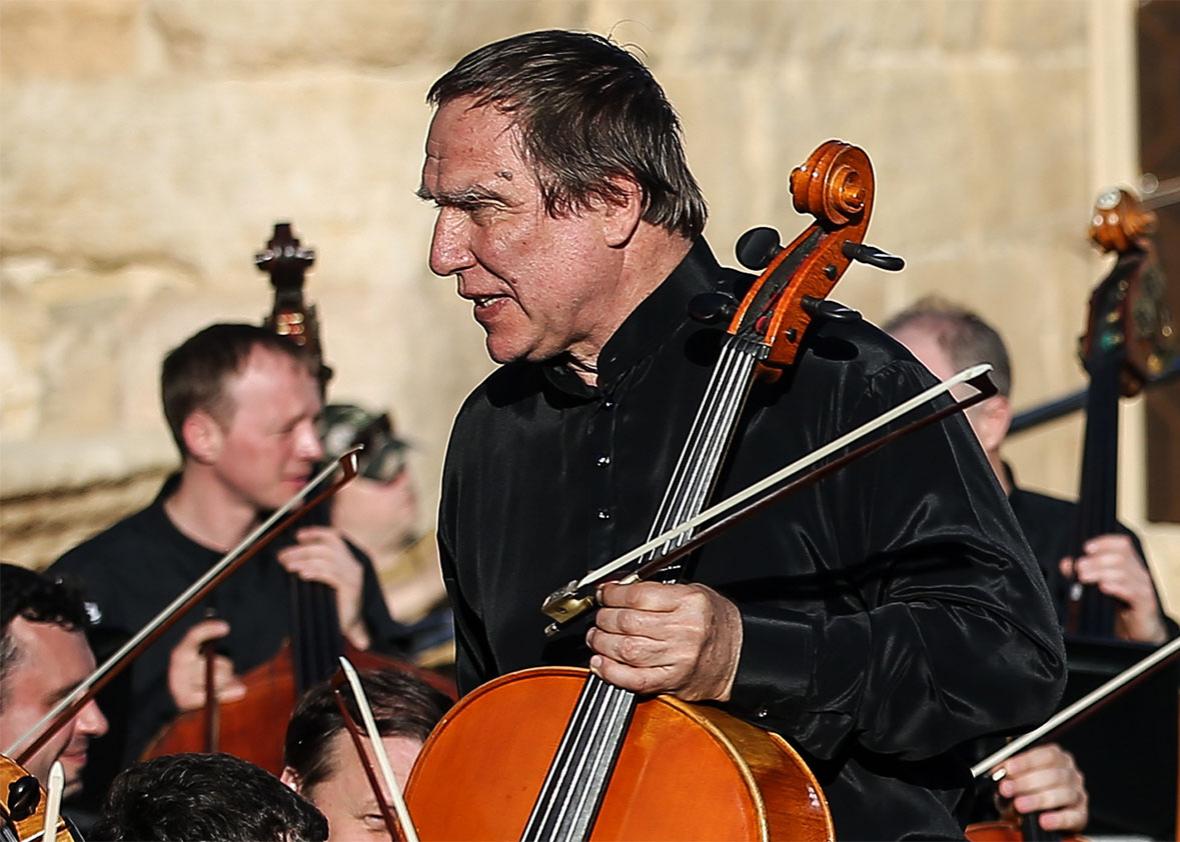 Cello player Sergei Roldugin performs in a concert by Mariinsky Theatre Symphony Orchestra at the ancient Roman amphitheatre in the town of Palmyra. 