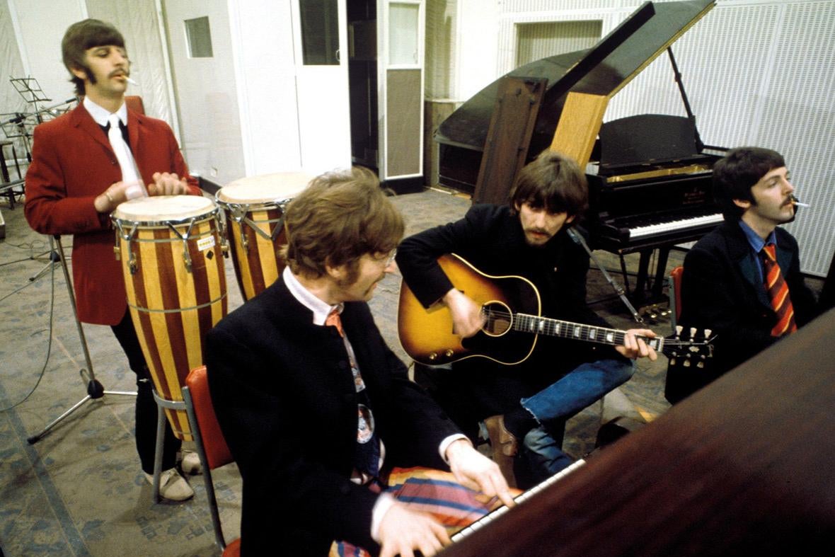 The Beatles working in a studio.