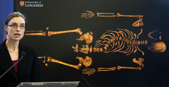 Dr Jo Appleby, a lecturer in bioarchaeology at Leicester University, addresses a press conference in front of an image of the skeleton of Britain's King Richard III, at the university in central England, on Feb. 4, 2013.