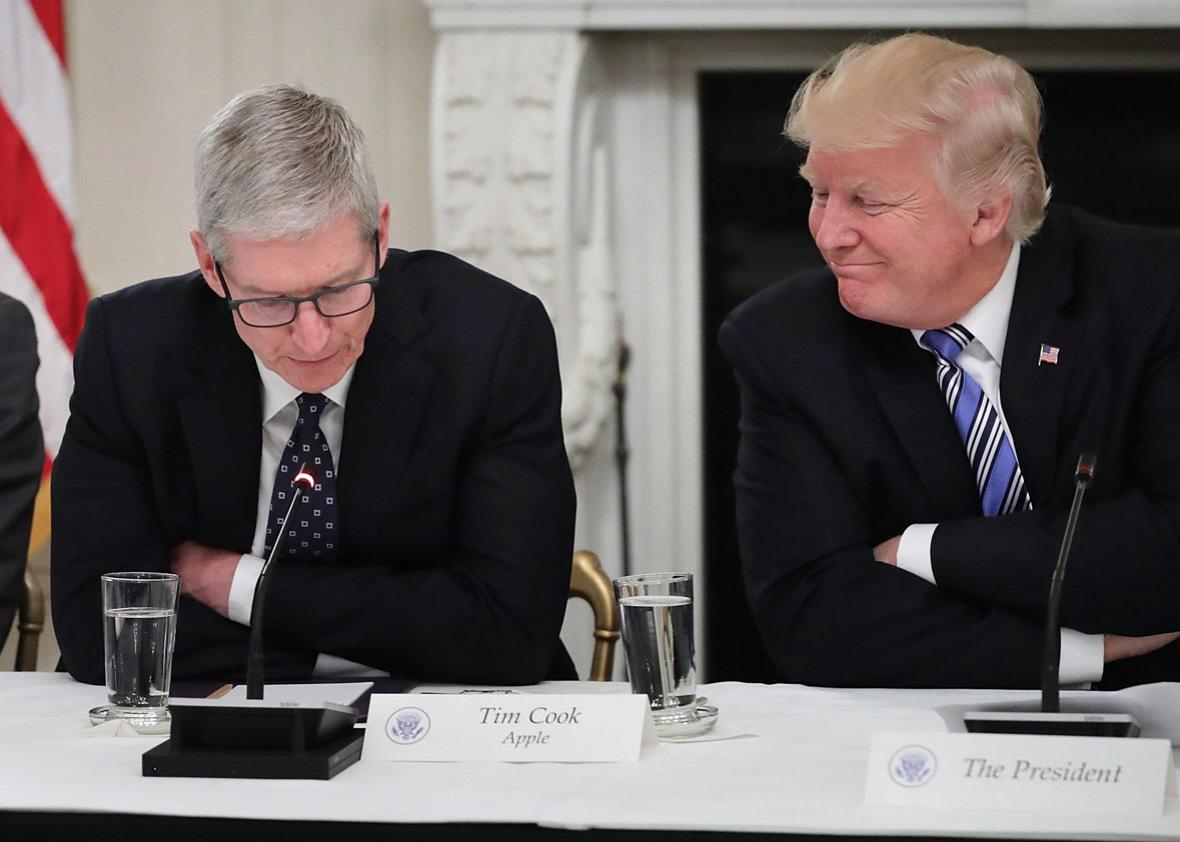 Apple CEO Tim Cook delivers brief remarks as U.S. President Donald Trump
