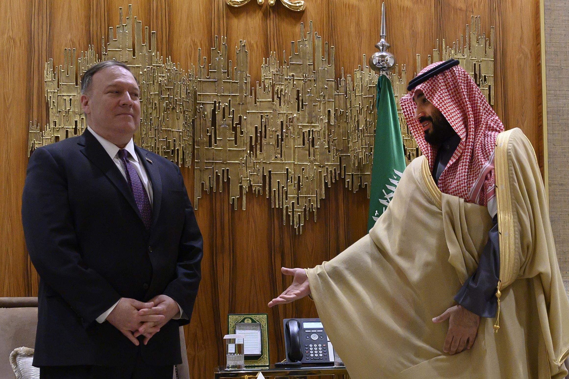 The Crown Prince gestures to Pompeo to sit during a meeting in Saudi Arabia.