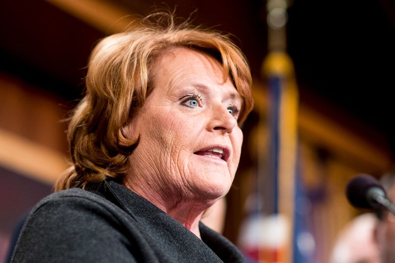 Sen. Heidi Heitkamp speaks into a microphone.