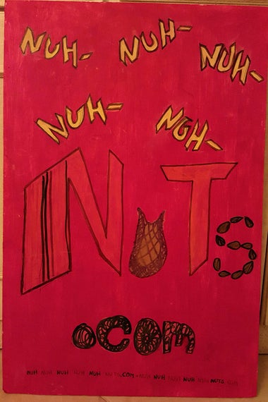 Childish handwriting on red construction paper reads, "Nuh- Nuh- Nuh- Nuh- Nuh- NUTS.com"