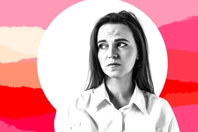 A white woman frowns and look up and to her right.