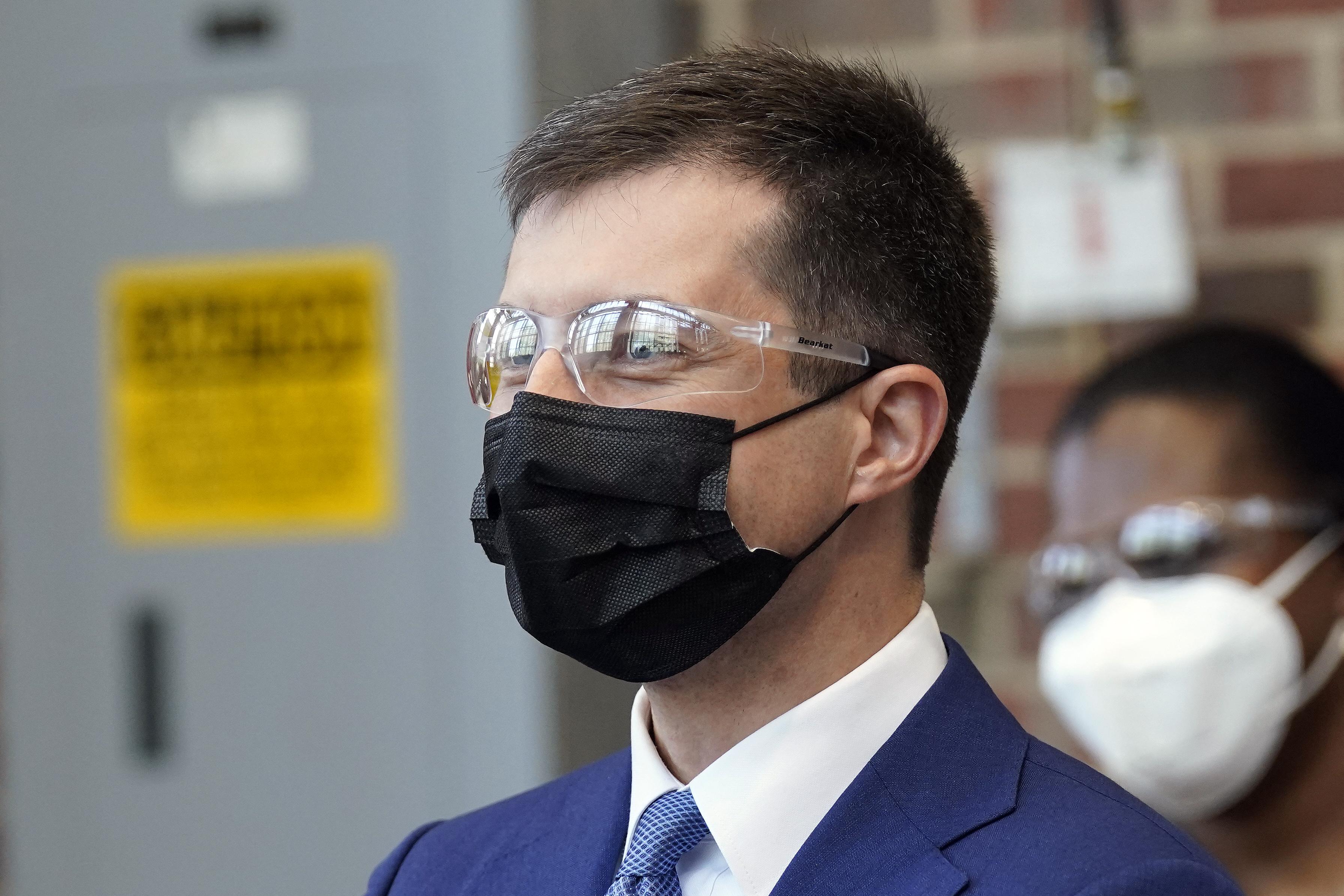 Pete Buttigieg wearing safety glasses and a mask at a demonstration in the engineering department at North Carolina State University on April 30