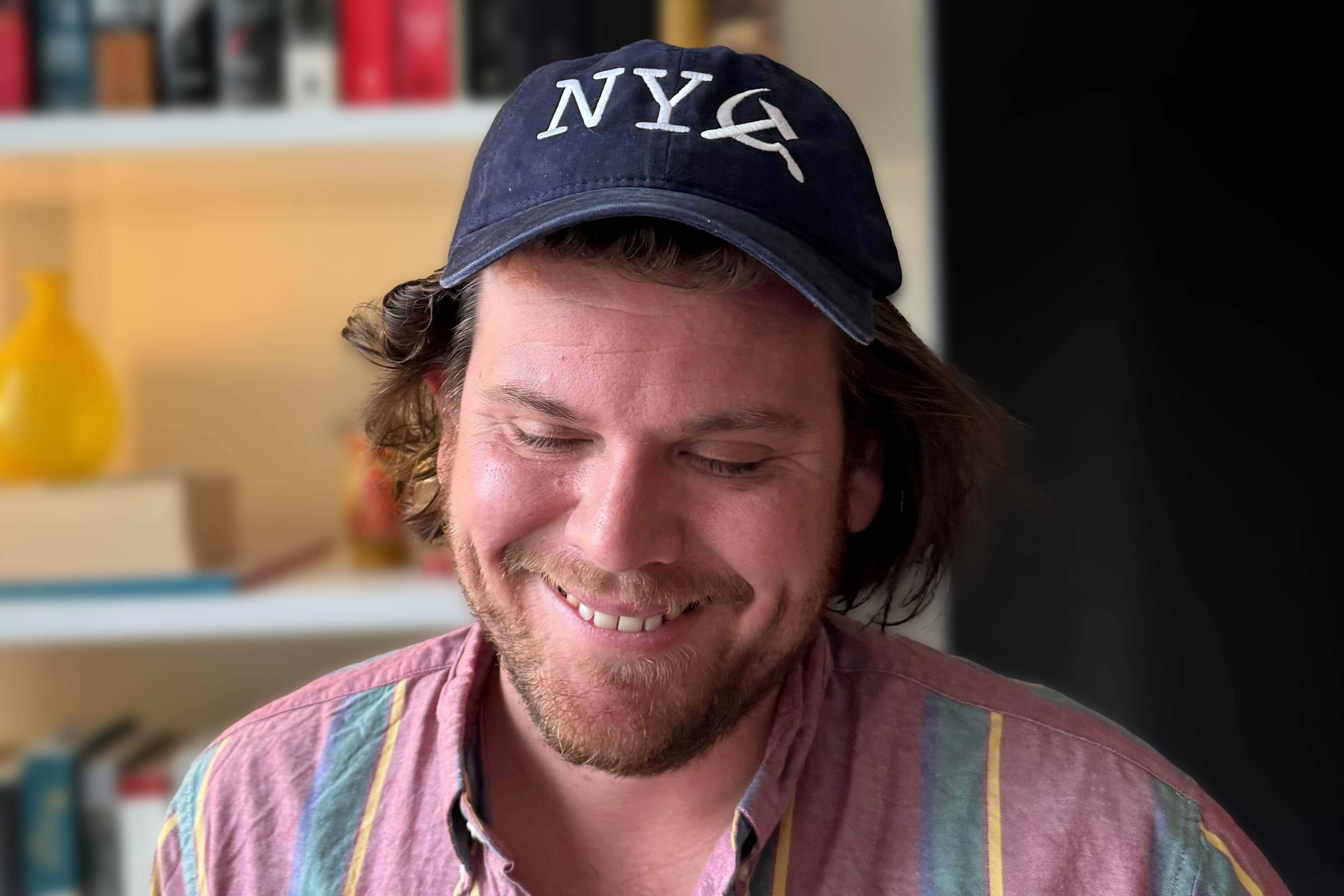 The author smiles in his N Y sickle hat. 