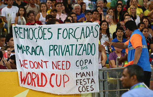 Protestors display banners during the FIFA Confederations Cup Brazil.
