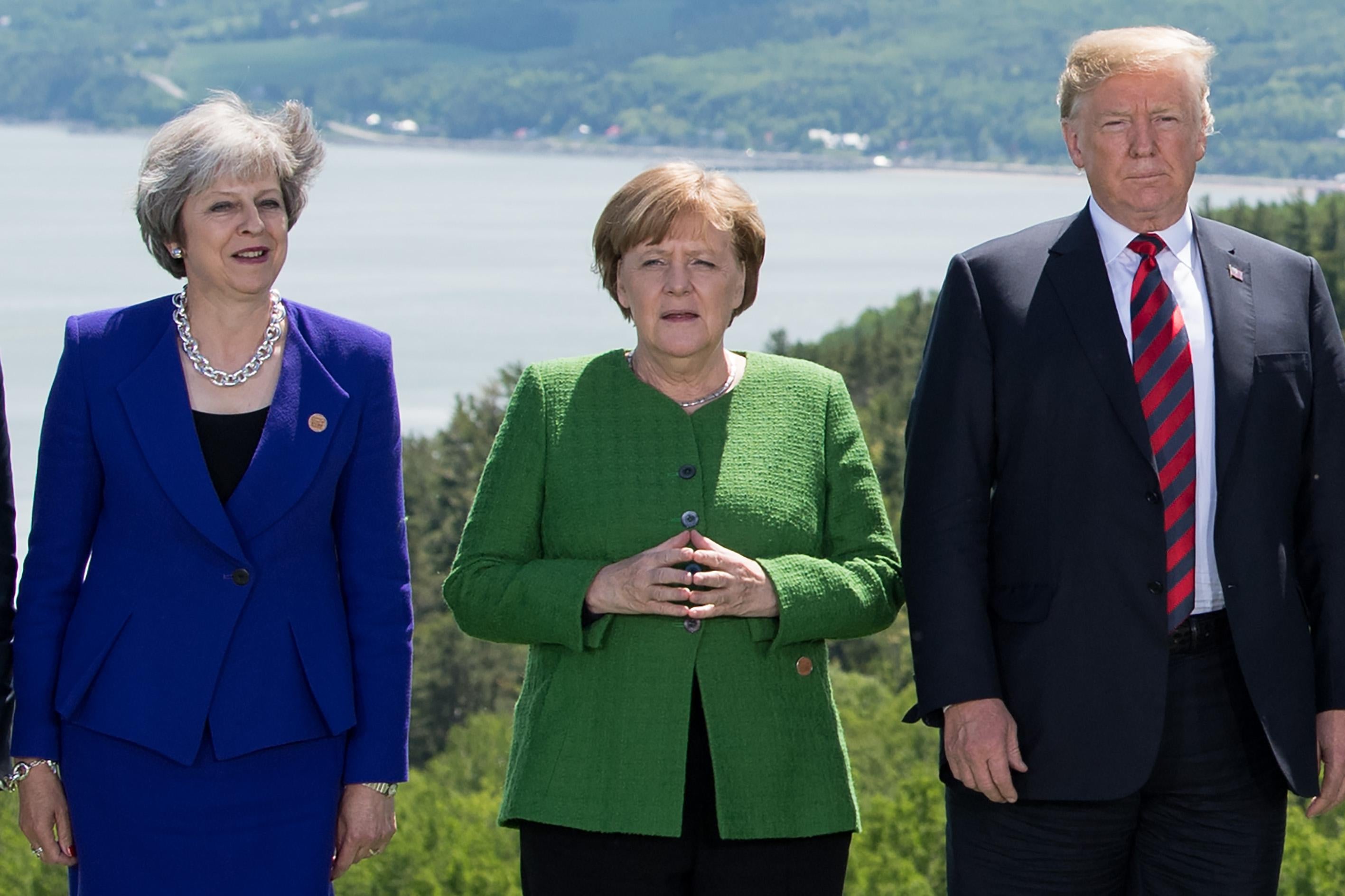 Theresa May, Angela Merkel, and Donald Trump.