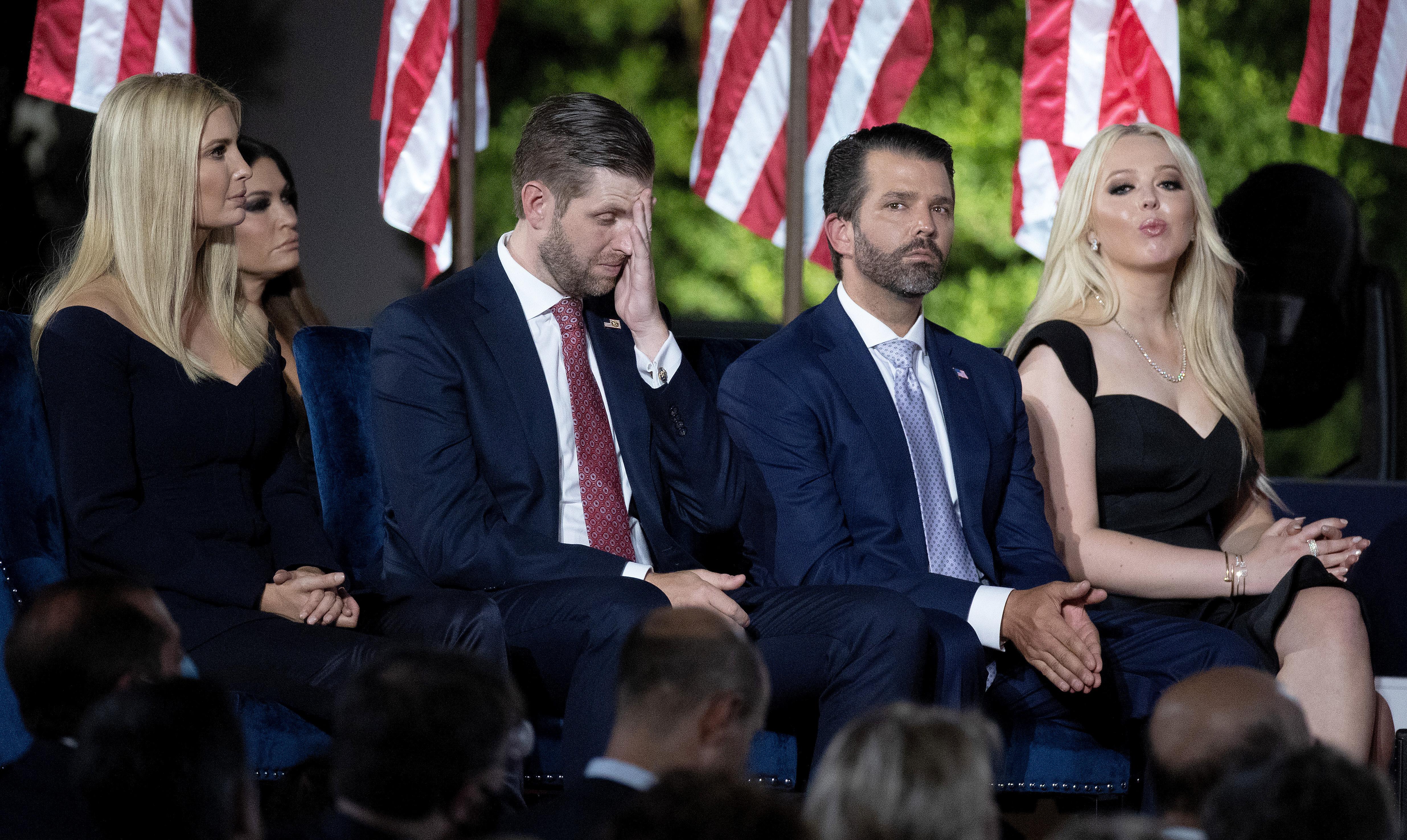 U.S. President Donald Trump's children, (L-R) Ivanka Trump, Eric Trump, Donald Trump Jr. and Tiffany Trump, sit on the stage as their father delivers his 70-minute acceptance speech for the Republican presidential nomination on the South Lawn of the White House.