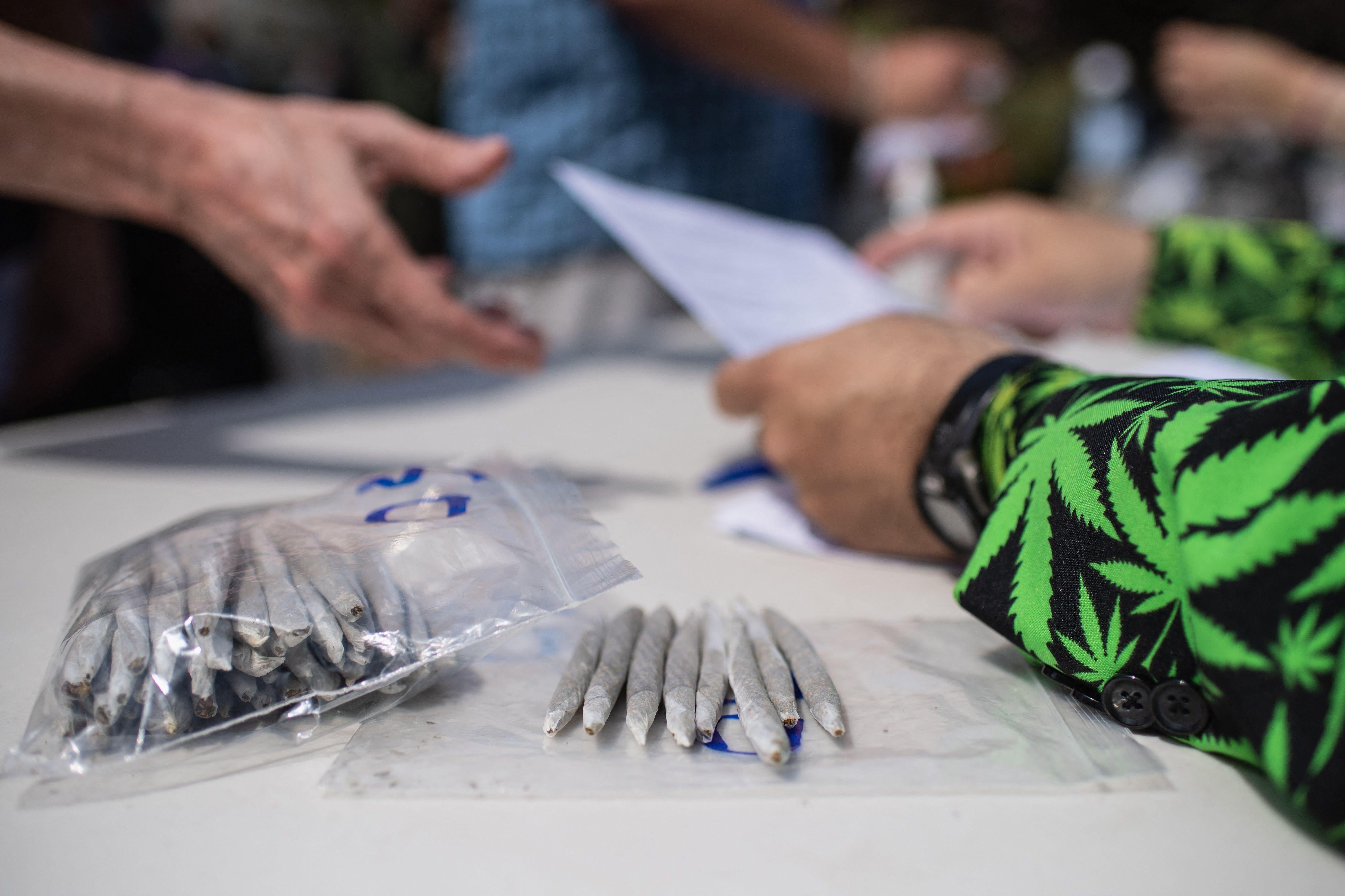 Marijuana activists hand out free joints to vaccinated New Yorkers on April 20, 2021 in New York City. (Photo by Angela Weiss / AFP) (Photo by ANGELA WEISS/AFP via Getty Images)