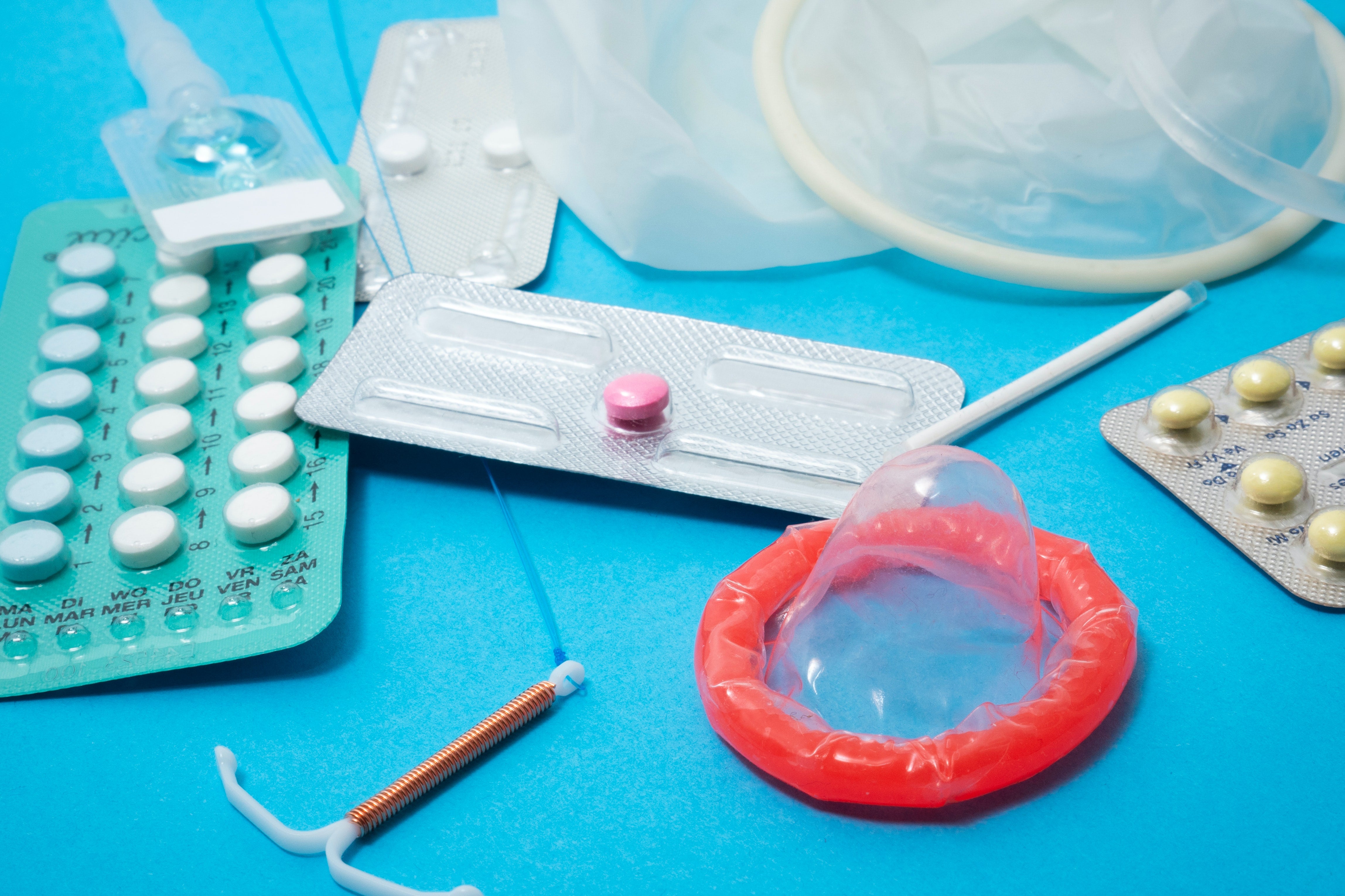 A bunch of birth control options: a condom, emergency contraception, birth control pills. 