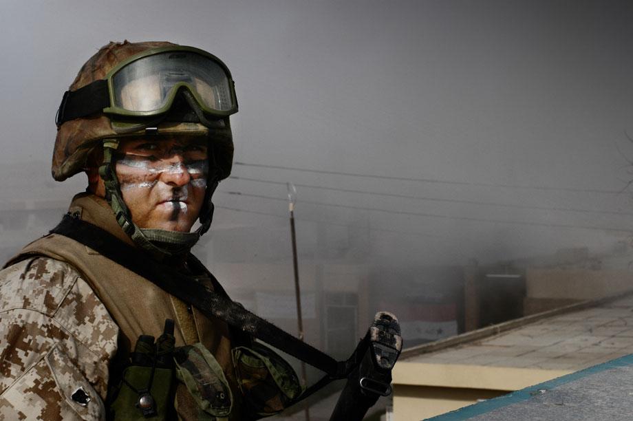 U.S. Marines of Weapons Company, 1st Marine Expeditionary Force (I MEF), clear civilians from the area during the first day of an all-out military offensive against Iraqi insurgents north east of Fallujah, Al Anbar governorate, Iraq on Nov. 8, 2004. Civilians flee the city under the protection of the marines. Located some 40 miles west of the Iraqi capital, Fallujah has been the epicenter of a resistance that has dogged U.S. and Iraqi forces for over a year. On the eve of November 8th, in an attempt to recapture the city, Operation Phantom Fury commenced and coalition troops pushed into the area from the west and south. Soon, combat engulfed the forces' advance, as insurgents engaged them with sniper fire and RPGs in one of the fiercest battles yet.