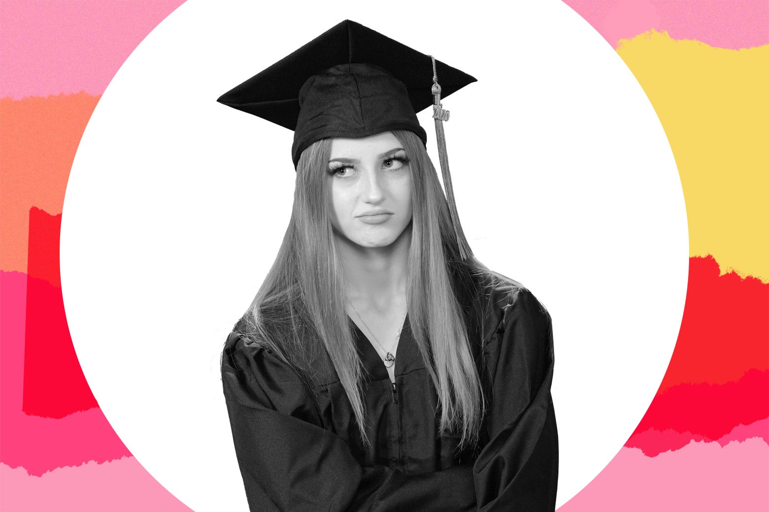 A young woman in cap and gown looks annoyed.