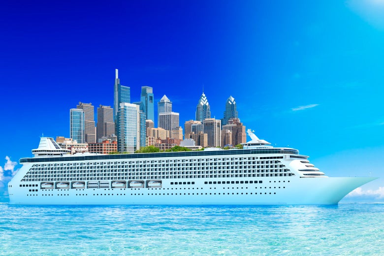 A city—Philadelphia, apparently—seen on top of a cruise ship's hull.
