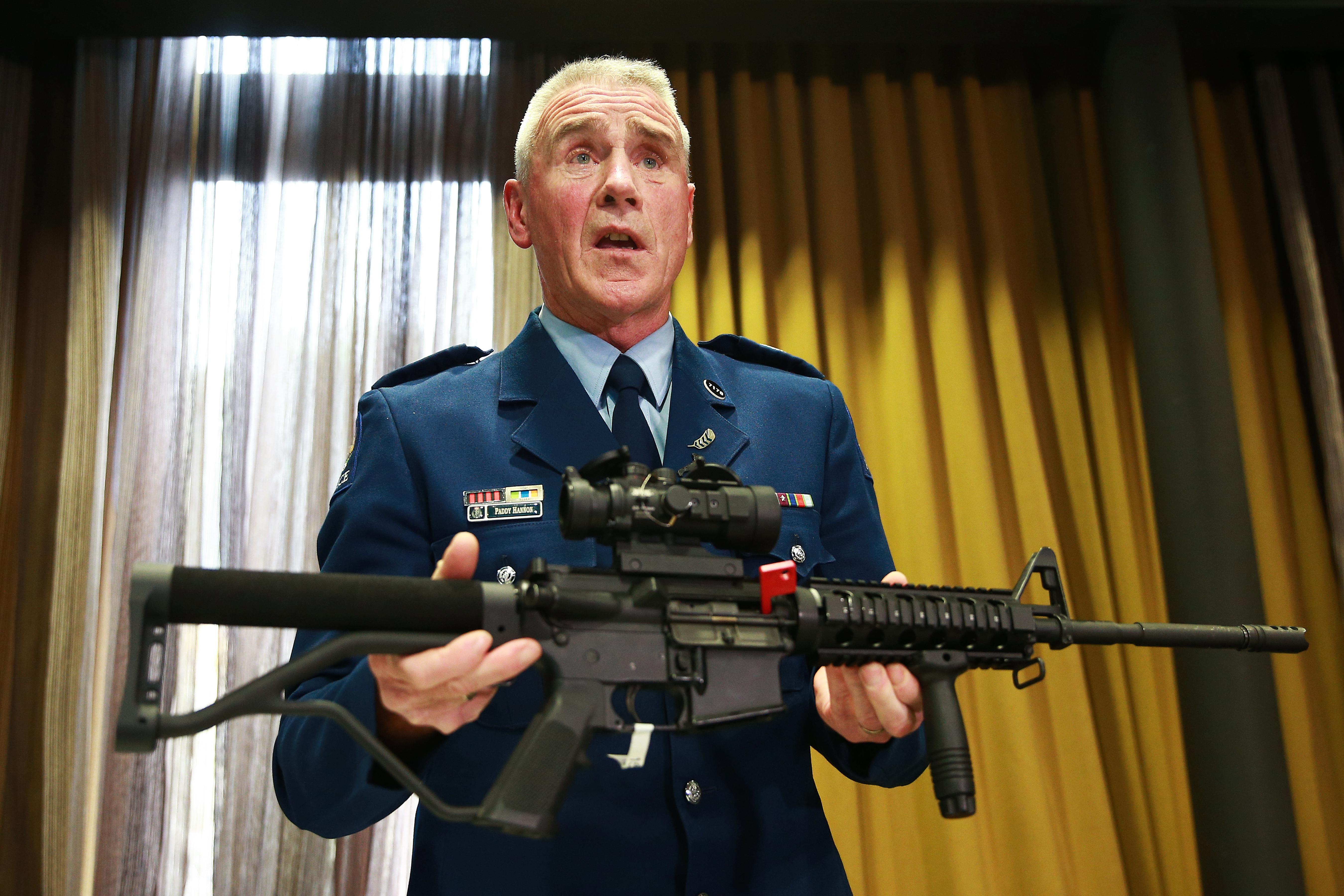 New Zealand official shows the type of gun banned under the new legislation during a press conference April 11, 2019 in Wellington, New Zealand.