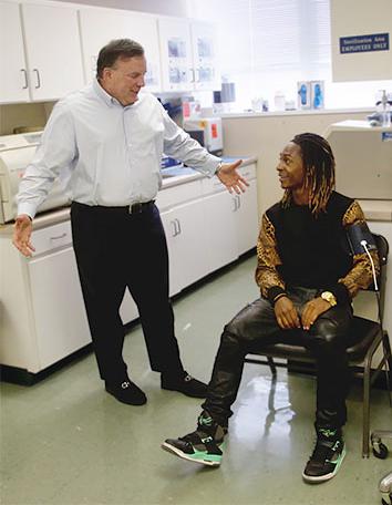 Jeffrey Parker talking with a Sarrell patient in our triage area.