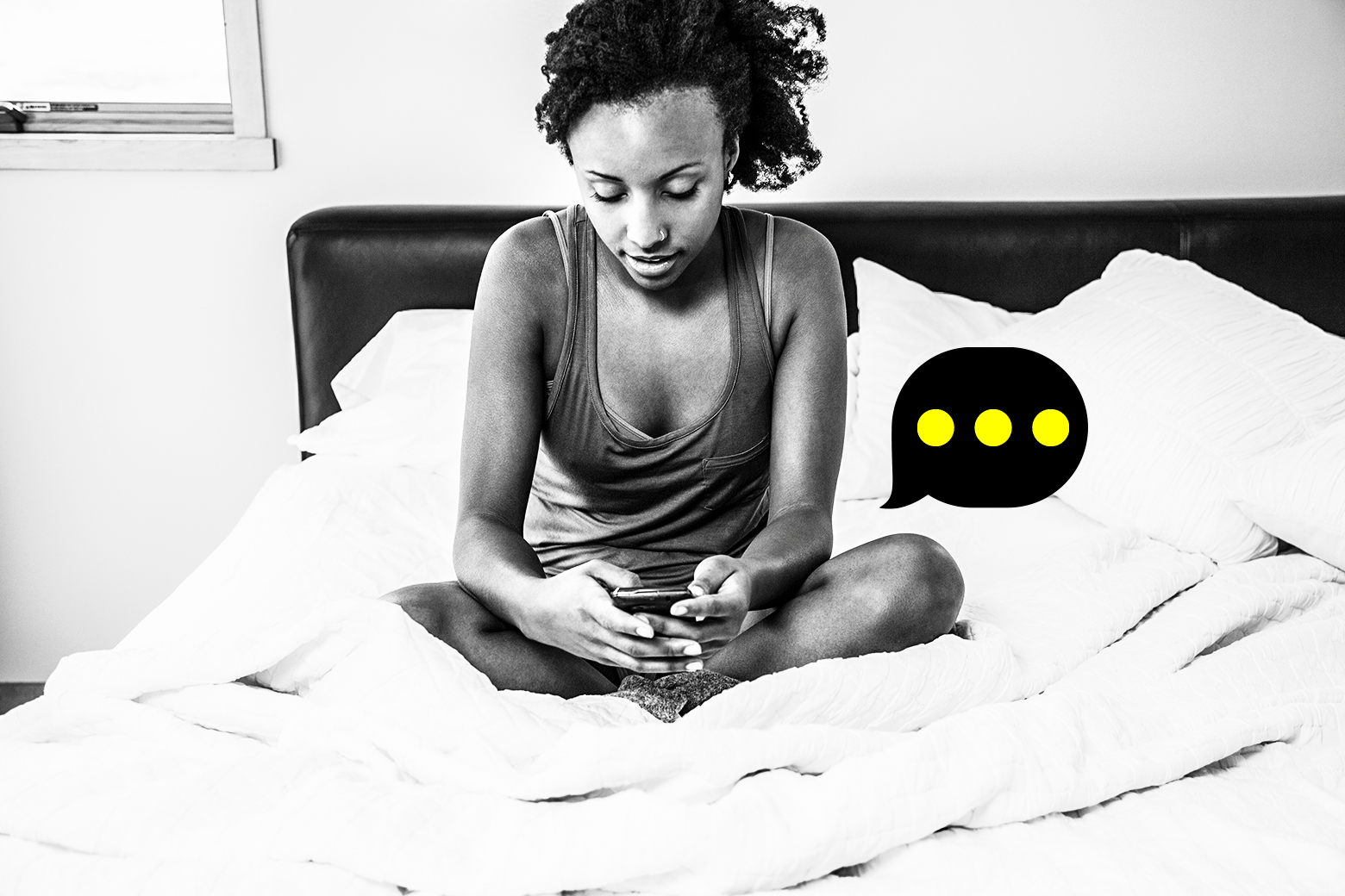 A woman looks at her phone next to a "typing" text bubble. 