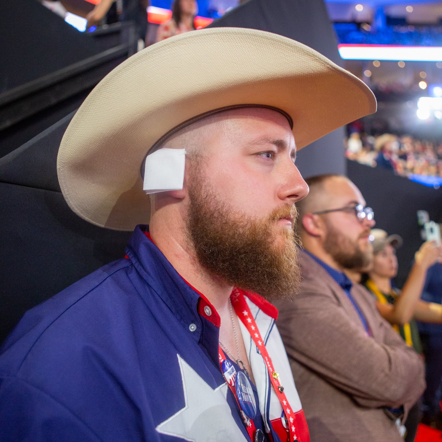 “It’s a statement on political violence,” explained Matthew, a Texas delegate, who wore a gauze patch on his ear to match Trump’s.