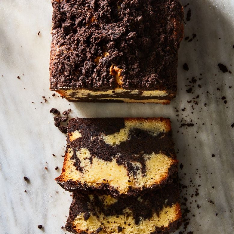 A loaf of crumbly marble pound cake, sliced