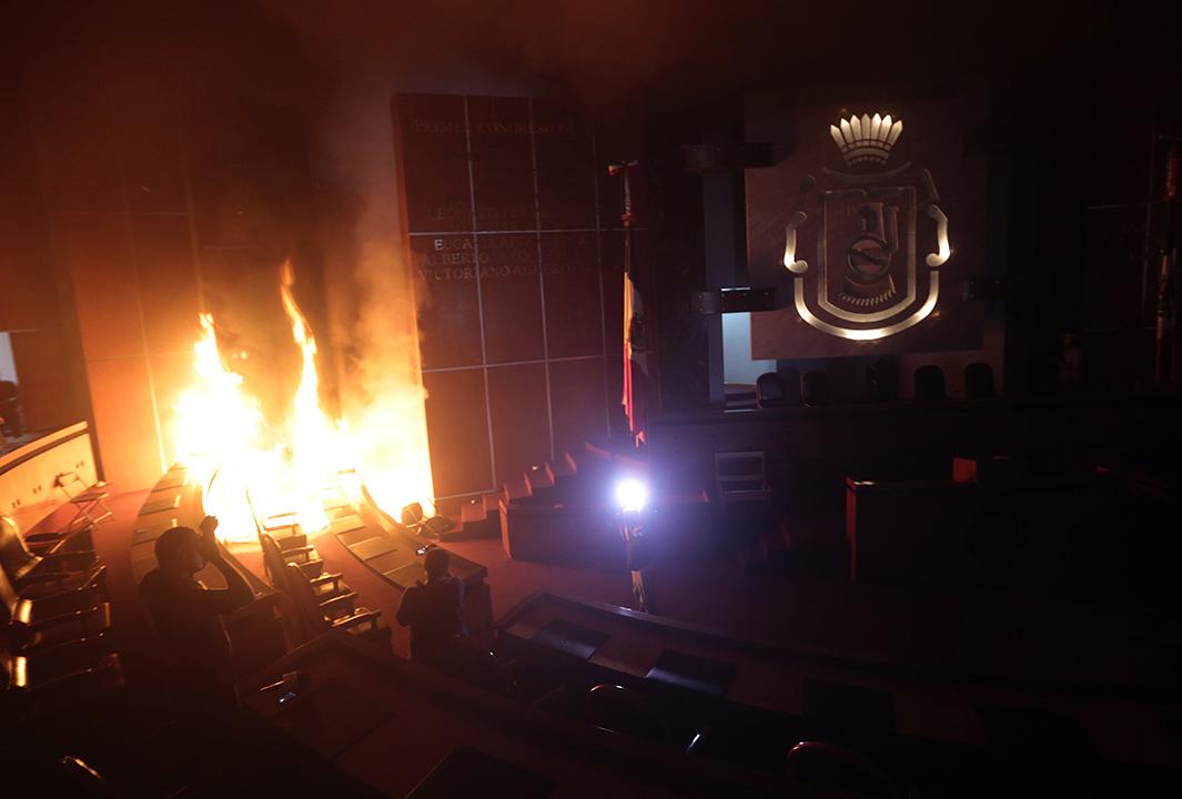 The main hall of the Guerrero state congress is set on fire by protesters in Chilpancingo, Mexico on November 12, 2014.