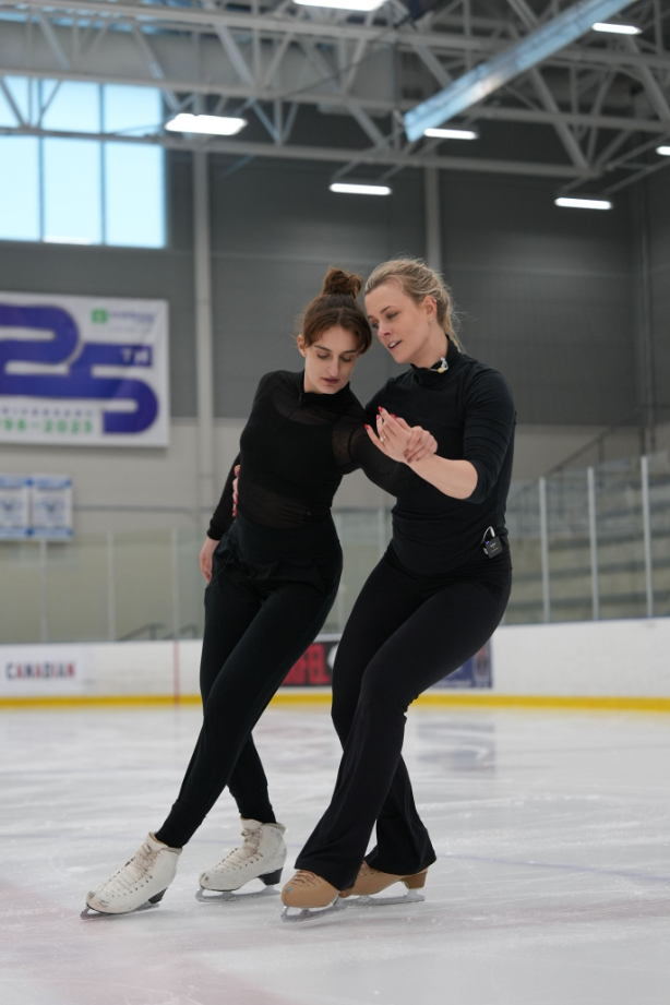 Hubbell and Papadakis skate together.