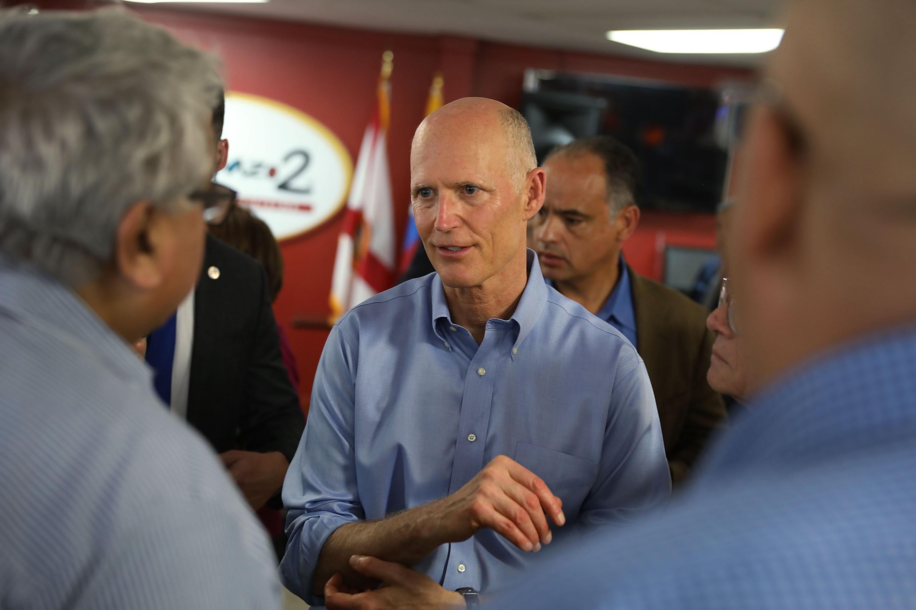 DORAL, FL - MARCH 28:  Florida Governor Rick Scott interacts with people at Restaurant El Arepazo 2 as he holds a bill signing ceremony for legislation to prohibit all state agencies from doing business with any entity that benefits the Venezuelan regime on March 28, 2018 in Doral, Florida. Gov. Scott said recently that he will have a big announcement on April 9, with many speculating that he will launch a Senate bid to challenge incumbent Democratic Sen. Bill Nelson for the seat.  (Photo by Joe Raedle/Getty Images)