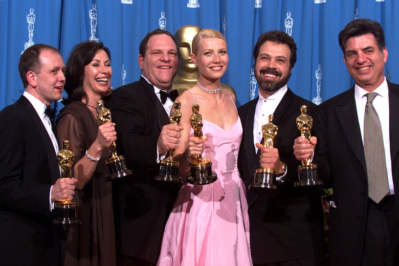 Shakespeare in Love Best Actress winner Gwyneth Paltrow (center) is joined by Harvey Weinstein and others backstage as they celebrated their win of Best Picture at the Academy Awards in Hollywood, California, on March 21, 1999
