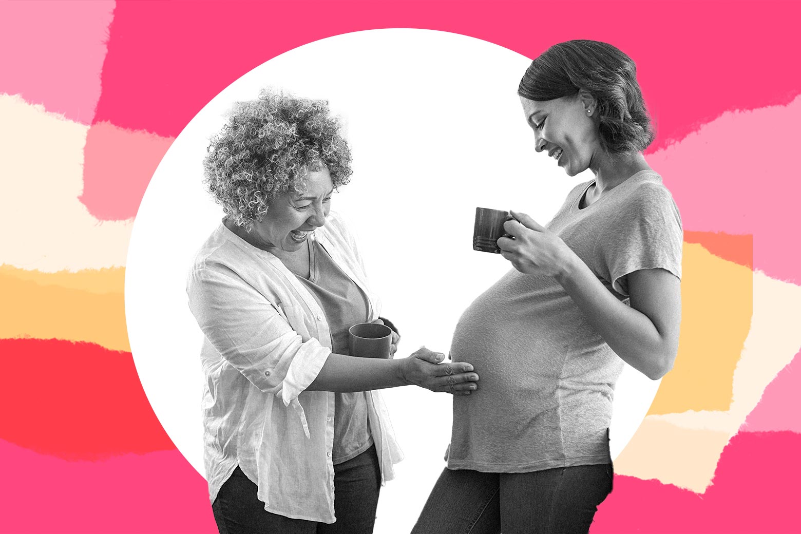 A smiling mom touching her smiling daughter's pregnant belly.
