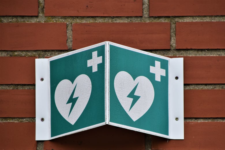 A heart with a lightning bolt inside it, a German symbol for a hospital