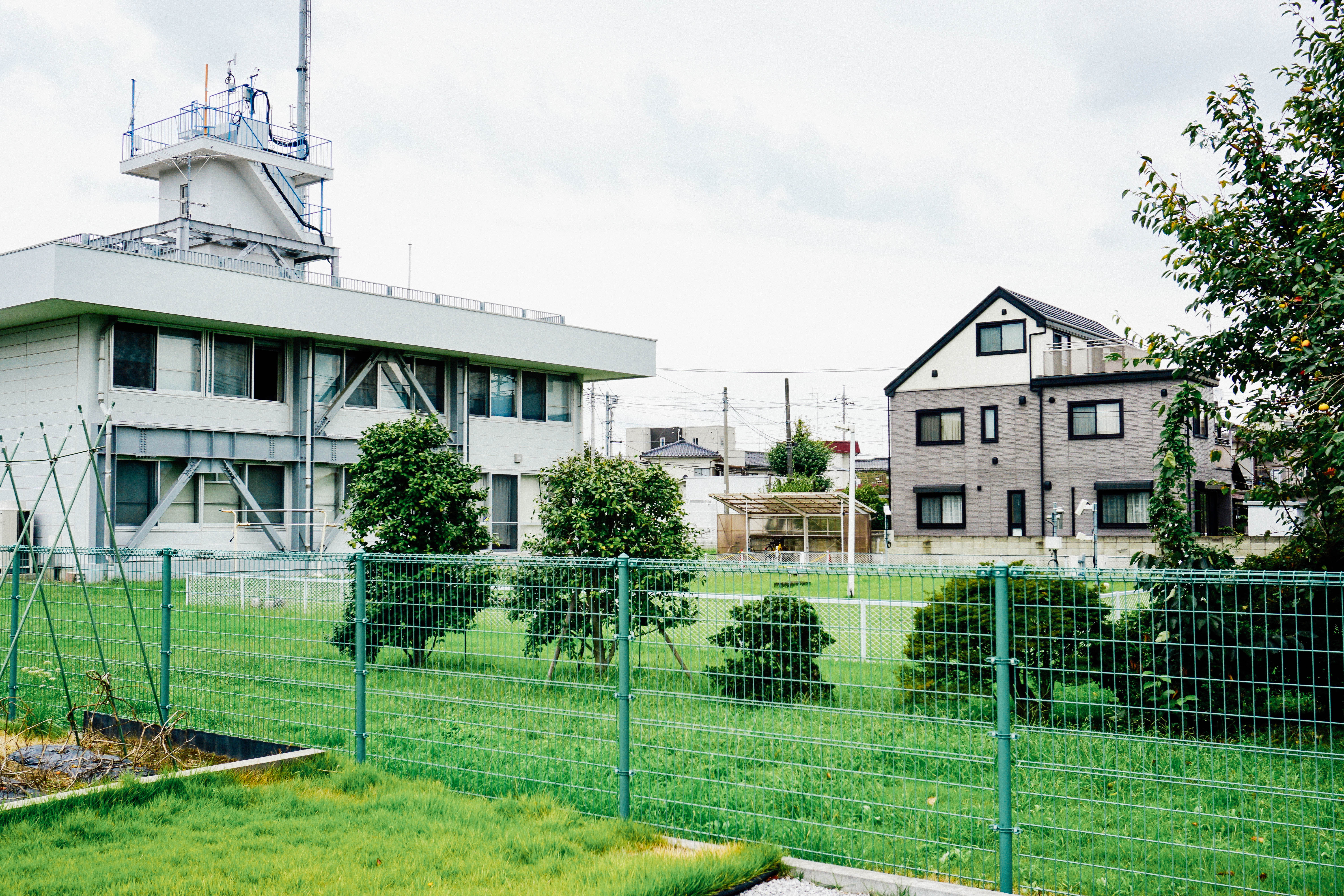 A building behind a fence in Japan