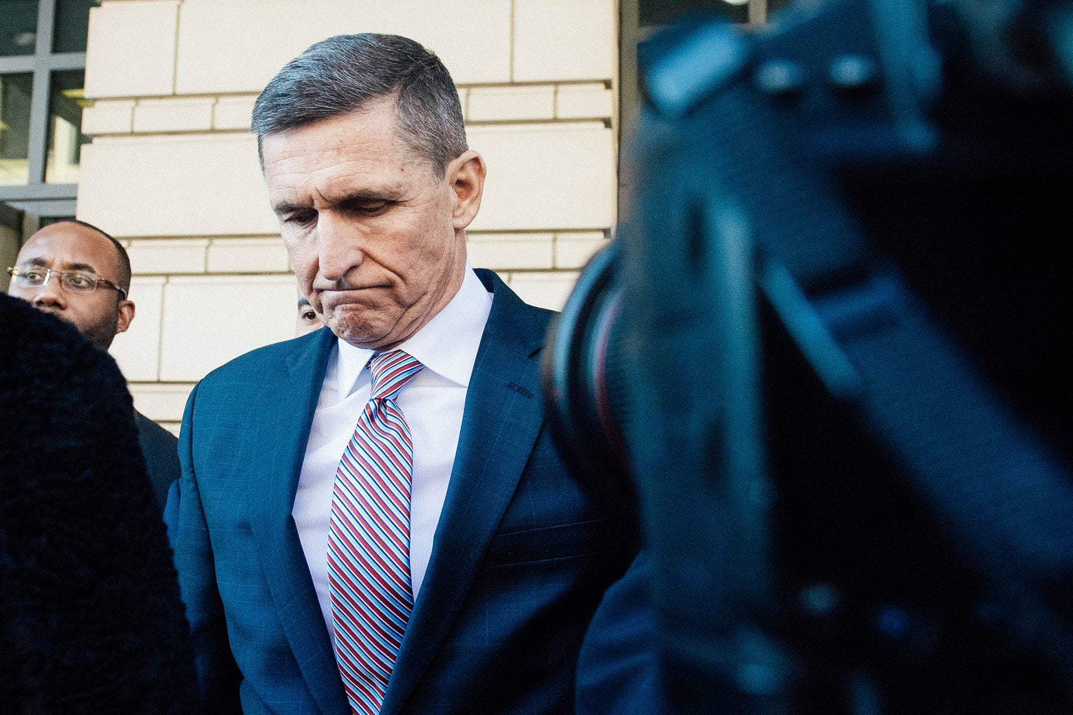 Michael Flynn leaves after the delay in his sentencing hearing in Washington on Tuesday.