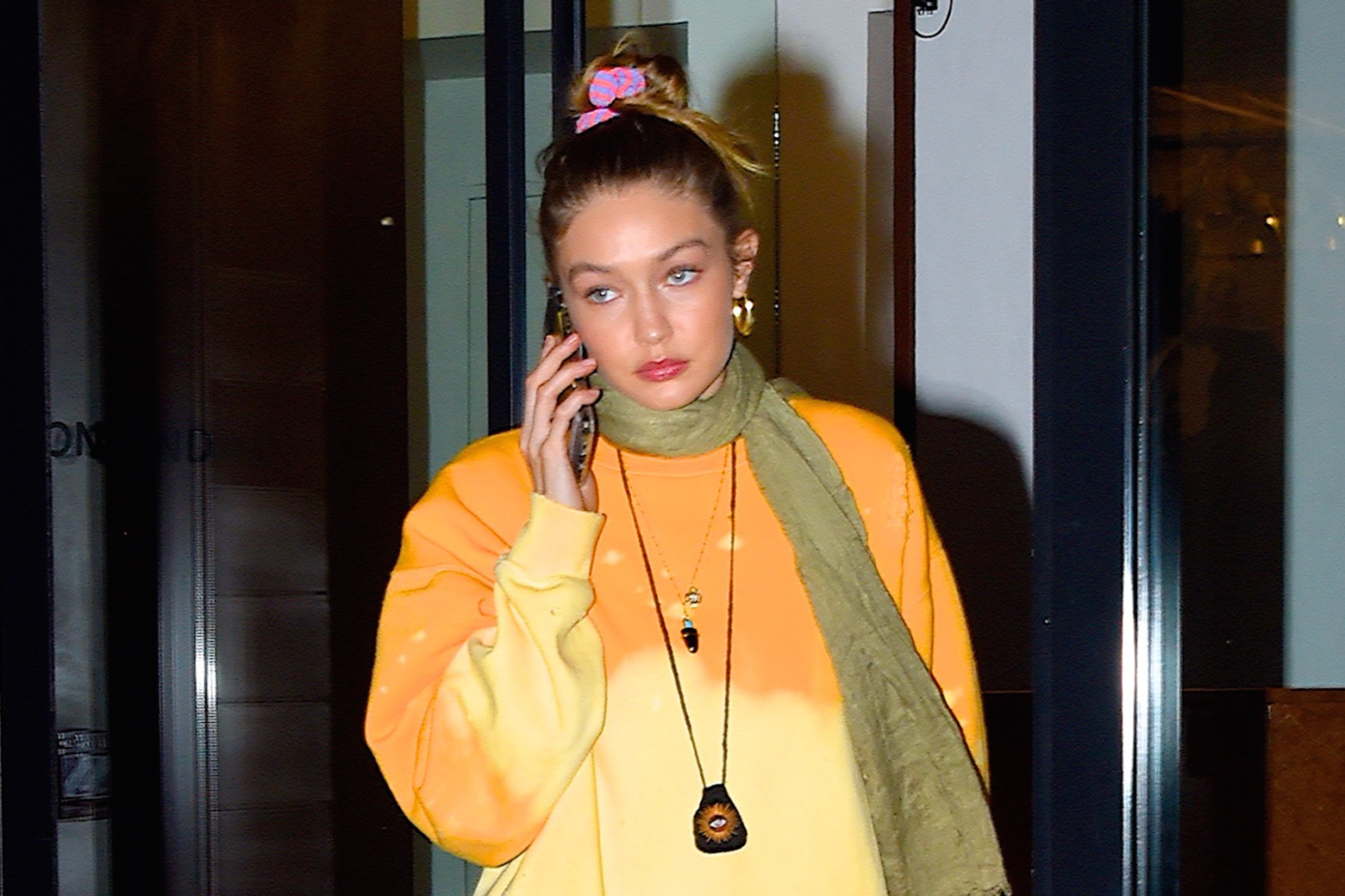 Gigi Hadid holds a cellphone to her ear.