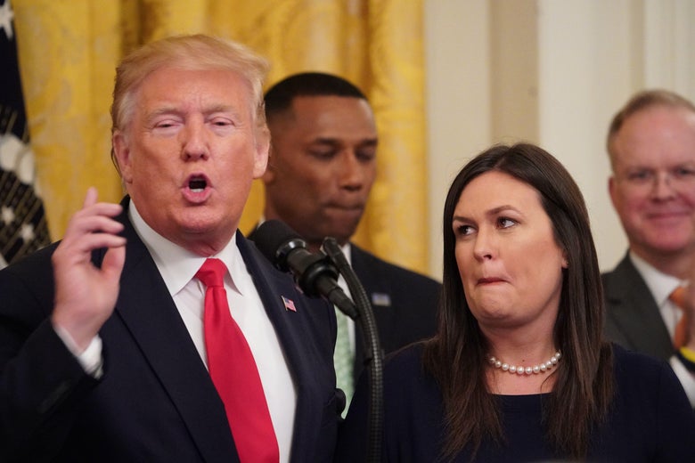 Sarah Huckabee Sanders looks at Donald Trump