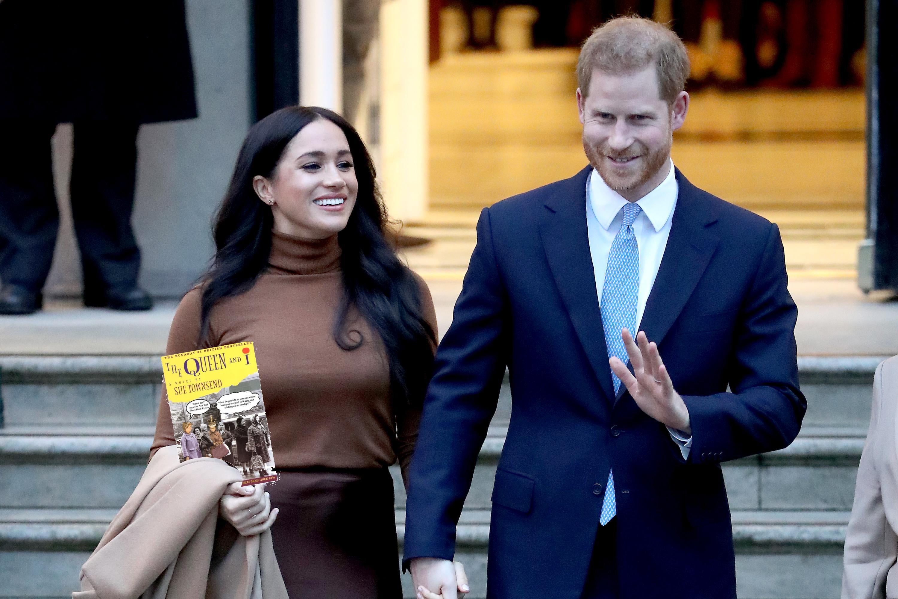Harry and Meghan hold a copy of "The Queen and I."