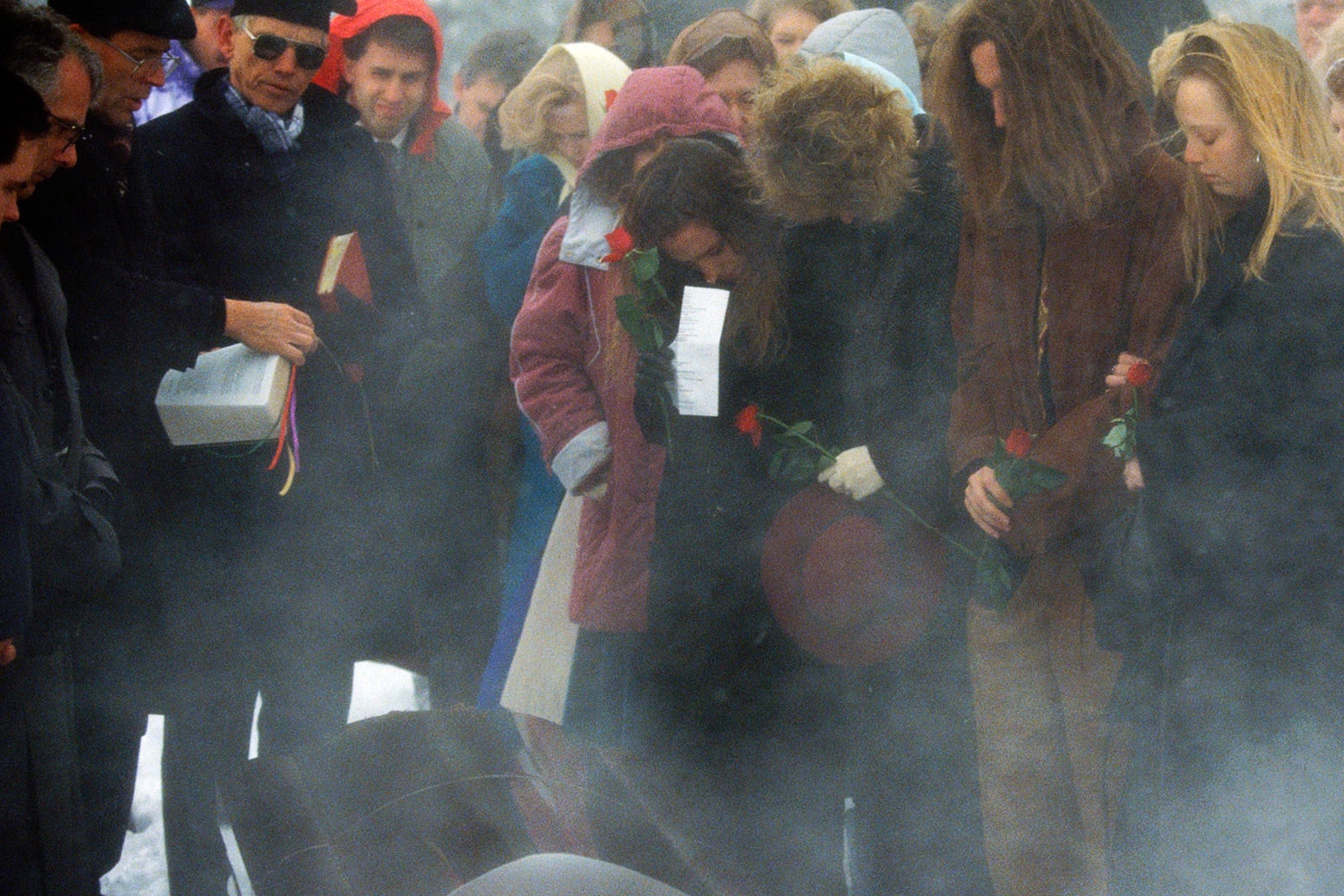 Family members stand around the coffin of Dr. David Gunn.