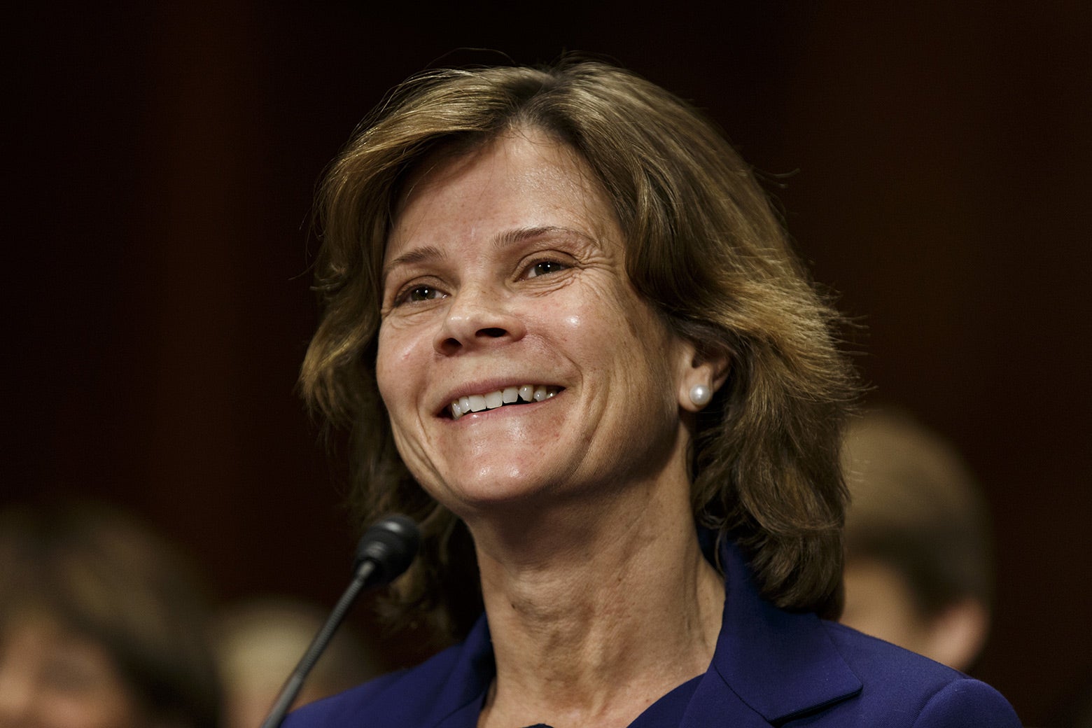 Amy J. St. Eve speaks into a microphone during her confirmation hearing in 
2018. 